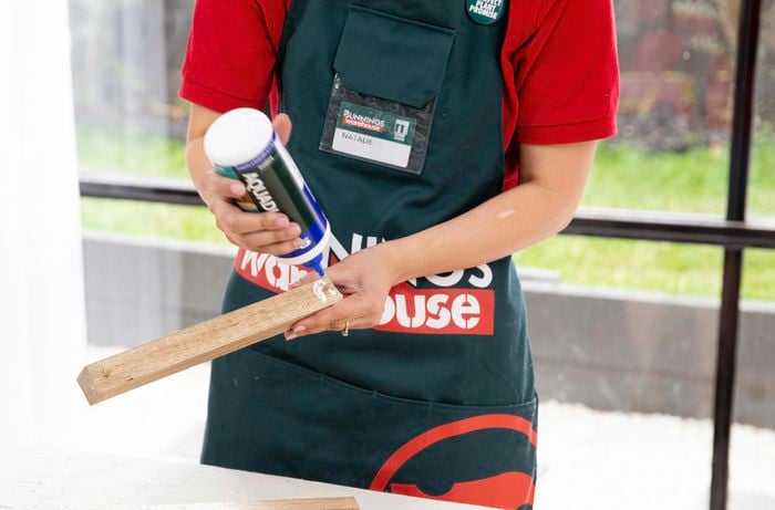 Glue being applied to a length of wood