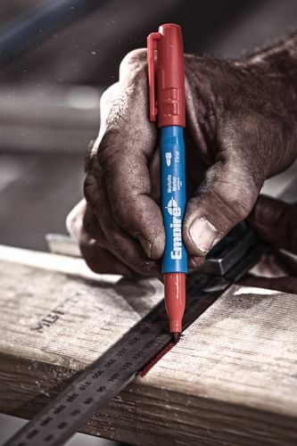 A piece of timber being marked for cutting with a felt tip marker