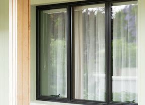 A clean glass window with black frame
