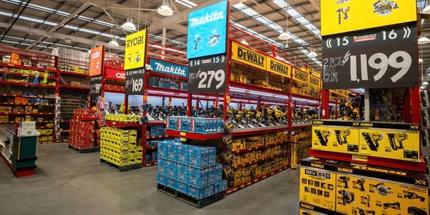 Interior of the Carrum Downs Bunnings tool shop featuring branded power tool bays with DeWalt, Makita and Ryobi displays and price signage.