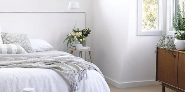 Bedroom painted white with white decor