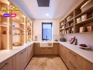 Butler’s pantry from The Block with timber cabinetry, open shelving, farmhouse sink, and stone benchtops.