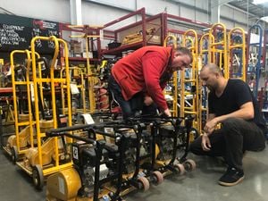Bunnings team member helping a customer select a tool.