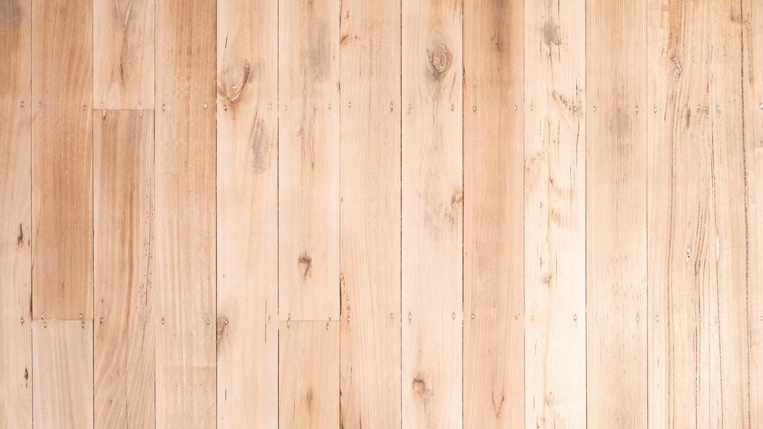 A close view of a sanded timber floor highlighting the wood grain and smooth finish.