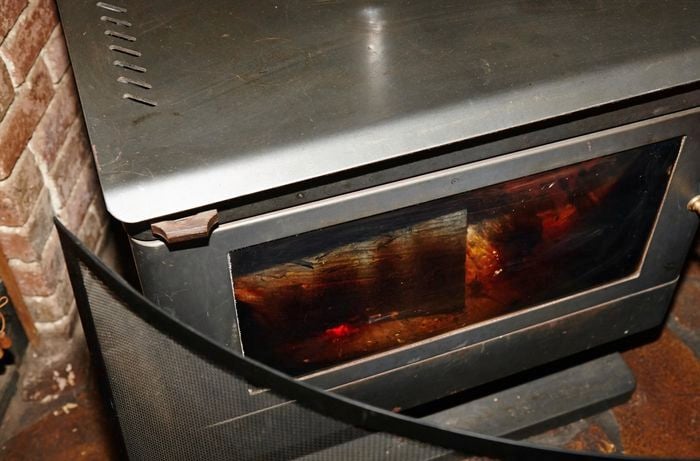 Discoloured glass on the front of a wood heater
