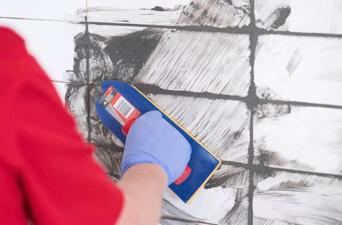 Apply the grout using a grout float
