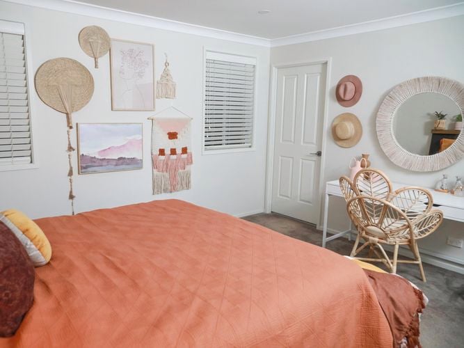 bedroom with art and frames on wall