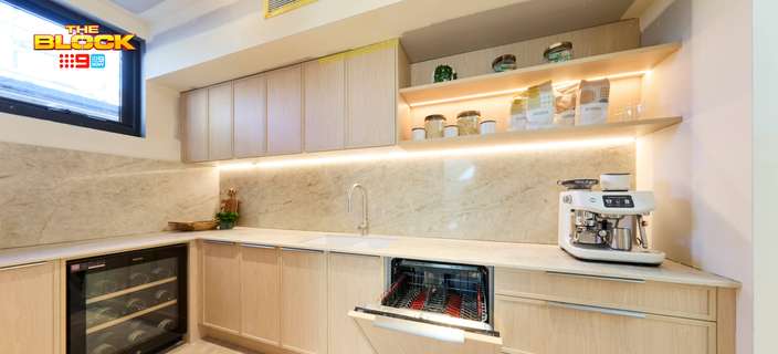 Modern butler’s pantry featuring light timber cabinetry, stone benchtops, open shelving and integrated appliances.