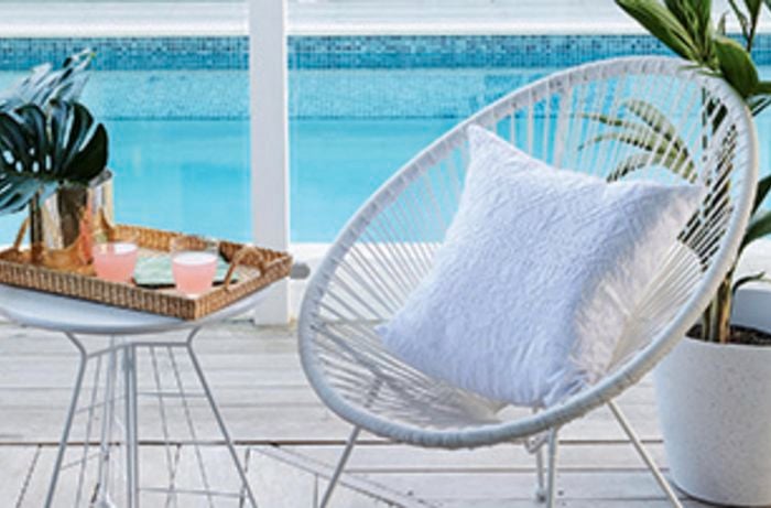 Outdoor chairs next to a pool