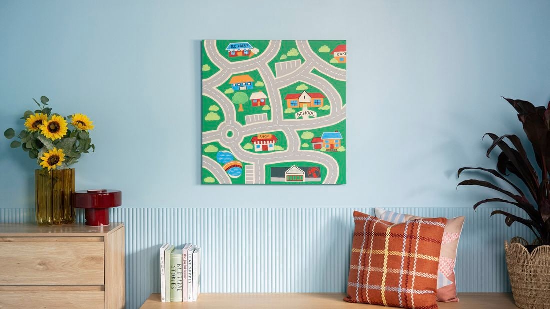  Nostalgic wall art featuring a road map with houses and trees