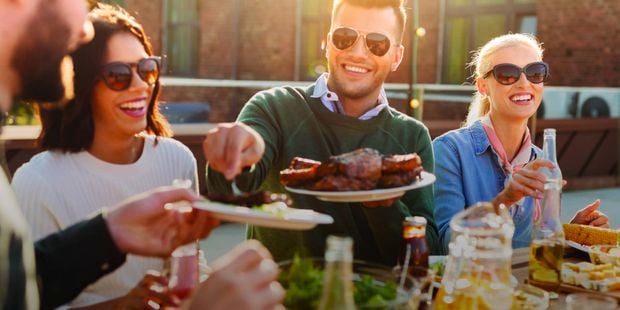 Image of please eating together in the backyard 