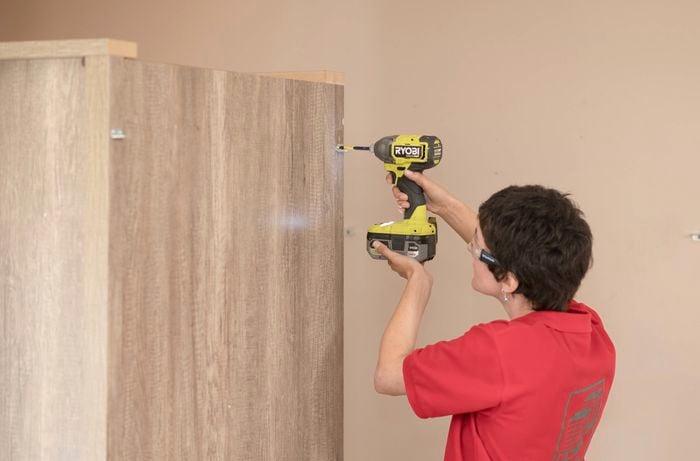 Installing the screws in the furniture