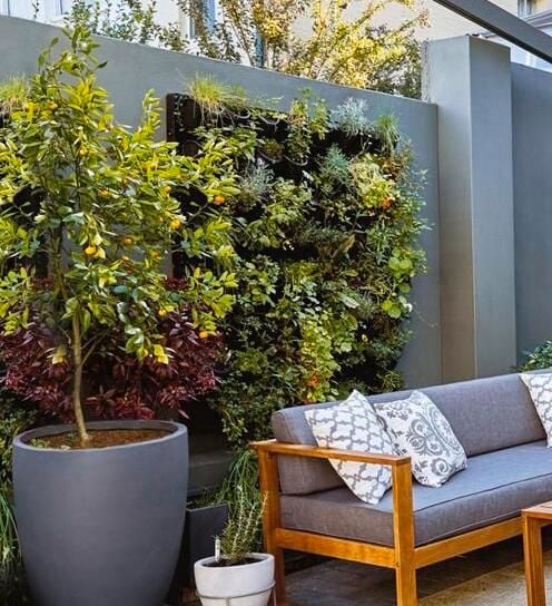Outdoor area featuring outdoor furniture and vertical garden.