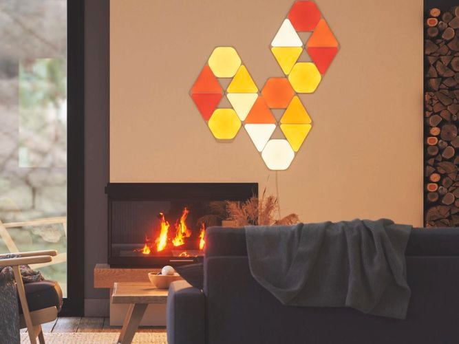 18 smart light panel layout mounted onto the wall above a fireplace.