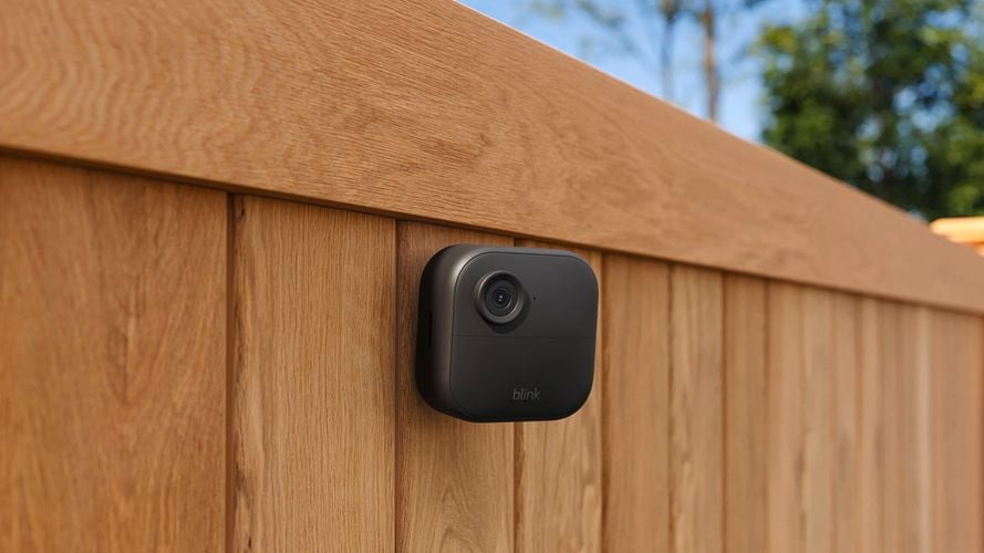 Smart camera on fence outside.