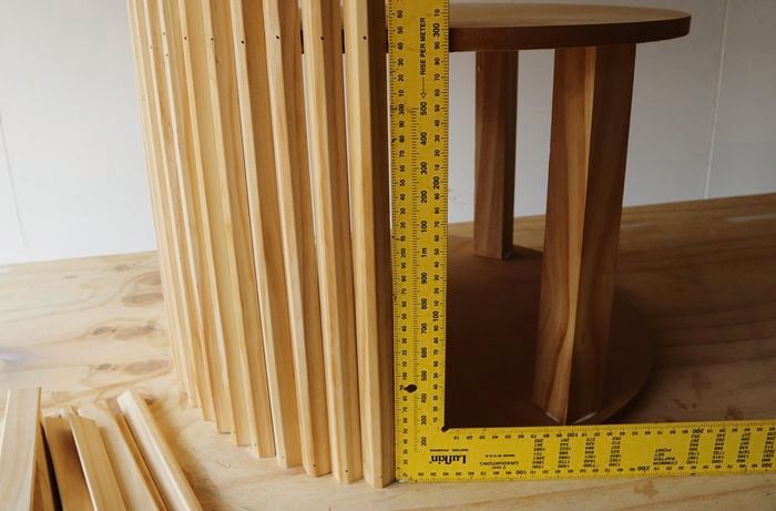 Person checking level of timber to ensure straightness