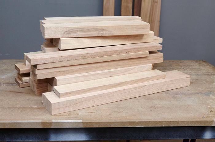 A pile of wooden plants to be used in the construction of outdoor furniture