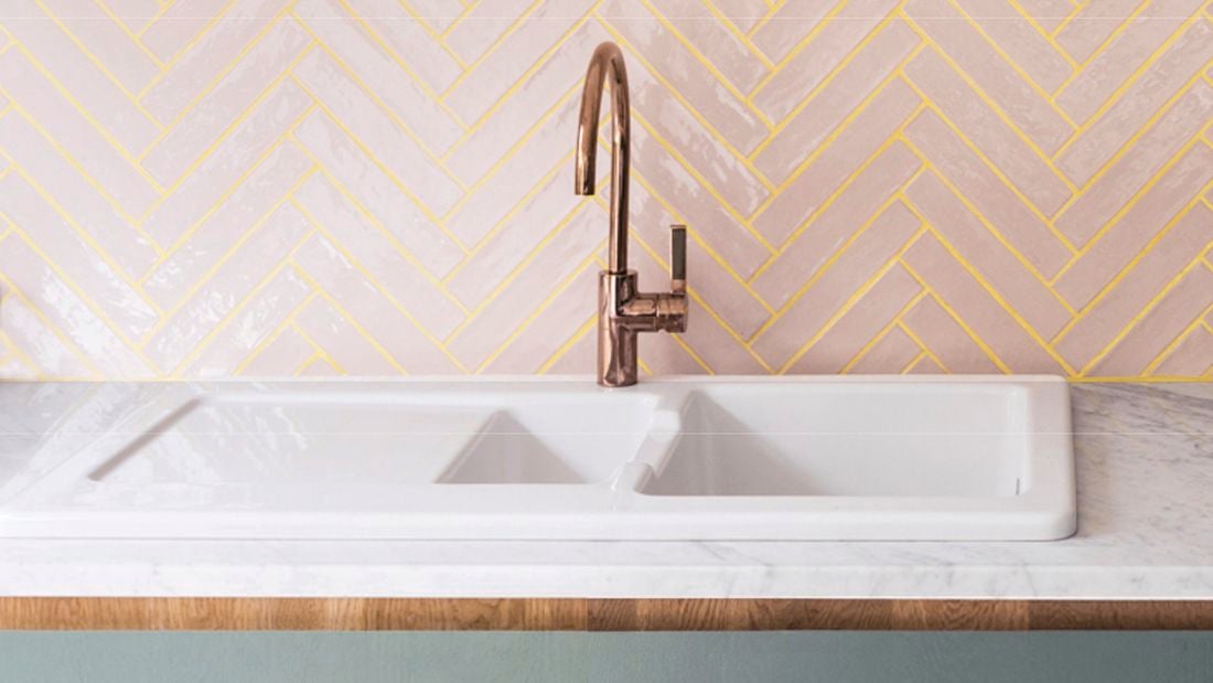 Bathroom tiles with a sink.