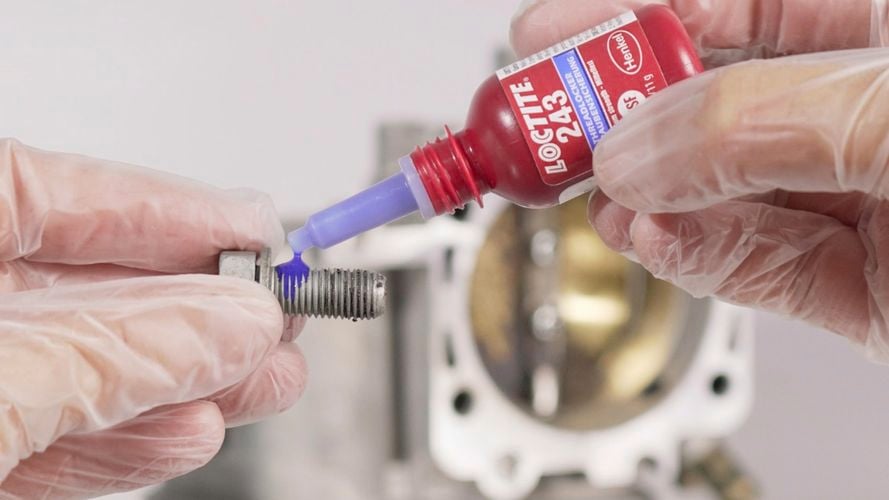 Loctite 243 Blue threadlocker being applied.