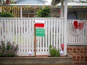 Letterbox with a santa sign out the front of a house