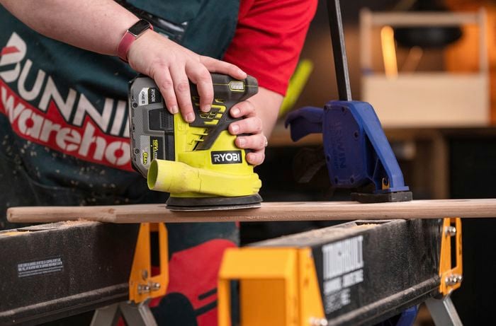 Sanding paddle with an electric sander