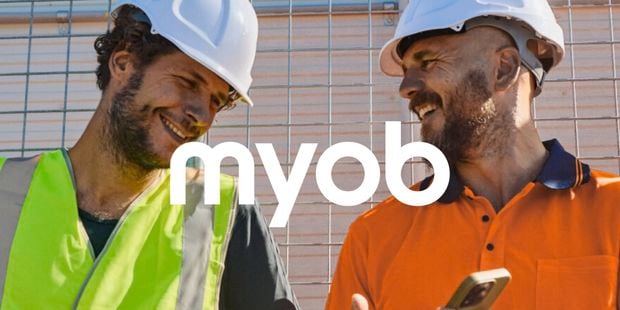 Two worked wearing white hardhats promoting MYOB