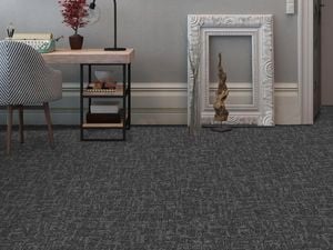 Office area with grey carpet tiles.