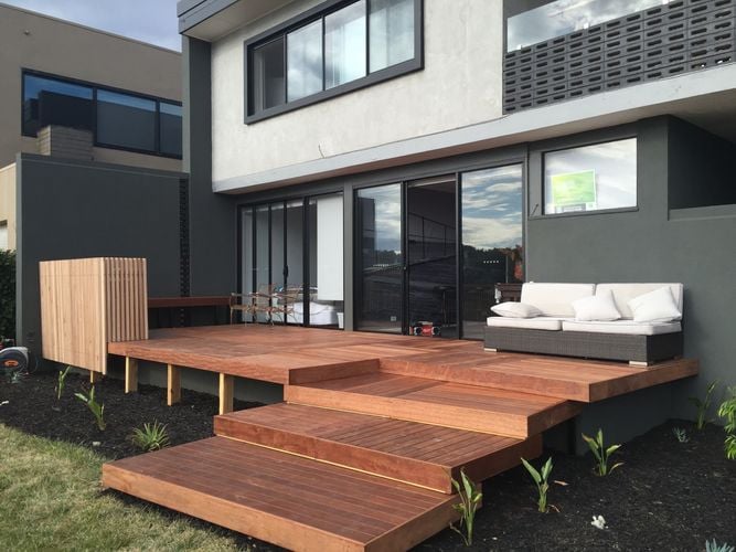 Tiered decking used as steps with an outdoor lounge