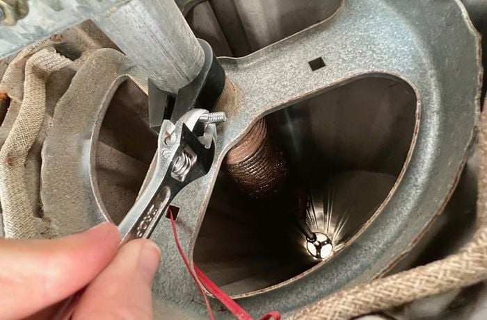 Person’s hand disables locks on roller door