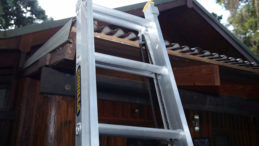 Ladder resting against a corrugated metal roof