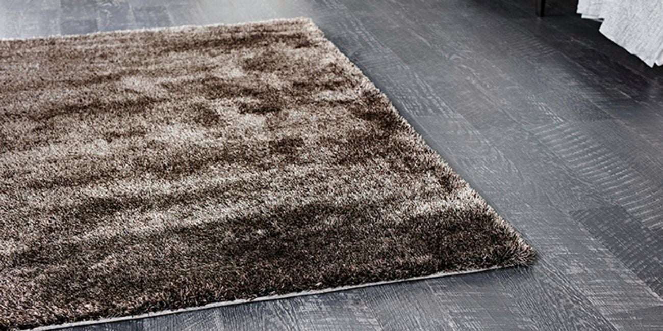 Shaggy rug in a living room with timber floorboards