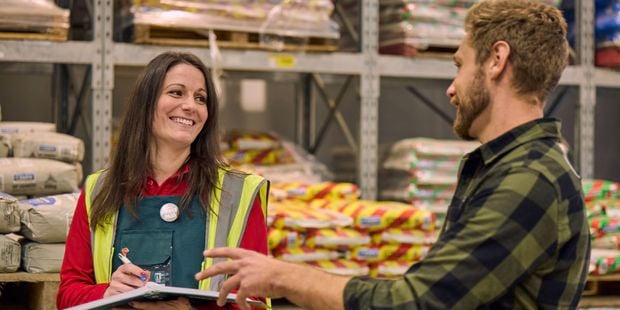 Bunnings team member talking to a customer instore