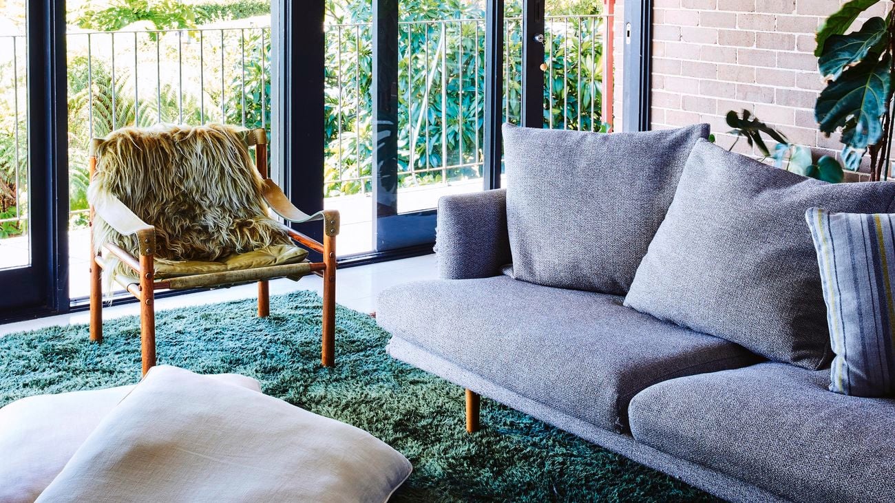: Lounge room with large sliding timber and glass doors