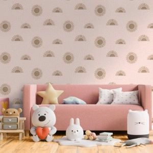 Kids room with pink couch, toys and sun wallpaper.