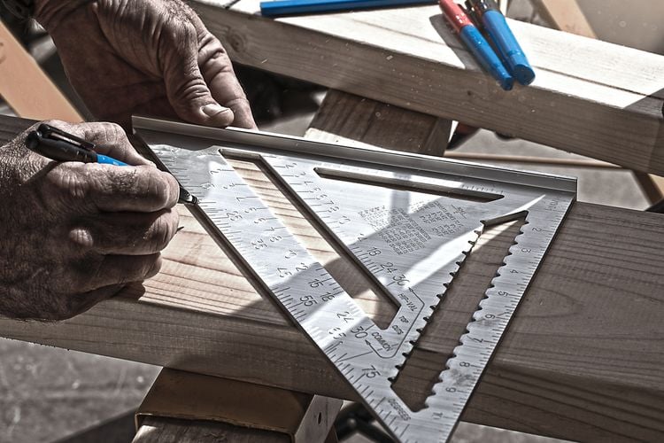 A piece of timber being marked for cutting