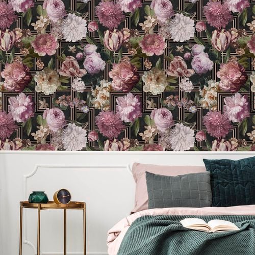 A bedroom with floral designed wallpaper.