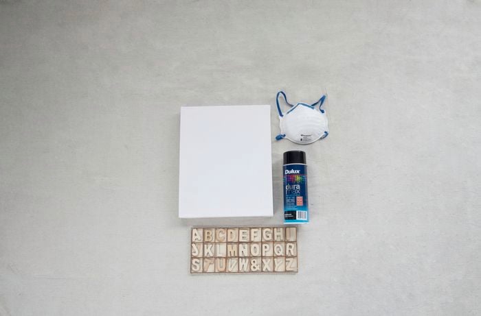 Mask, spray paint, canvas and craft letters